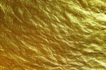 Luxurious Shiny Gold Foil Texture with Natural Wrinkles and Metallic Reflections