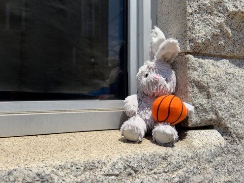 Stuffed animal left on a stone ledge