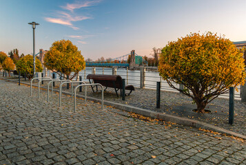 Autumn Riverside Promenade in Wroclaw with Grunwaldzki Bridge