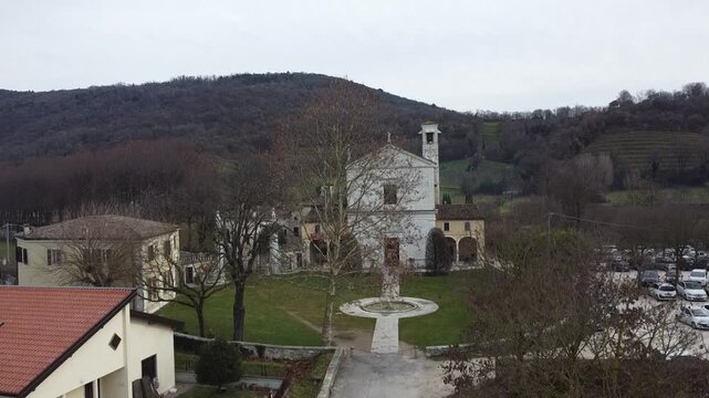 Aerial view of the historic Santa Maria Assunta Church, known as La Rotonda, in Rezzato, Italy. Ancient Romanesque architecture in the Valverde valley, Brescia province.