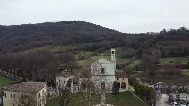 Aerial view of the historic Santa Maria Assunta Church, known as La Rotonda, in Rezzato, Italy. Ancient Romanesque architecture in the Valverde valley, Brescia province.