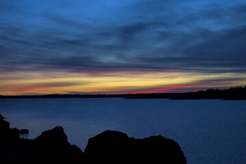 Colorful sunset over calm lake © MiguelA