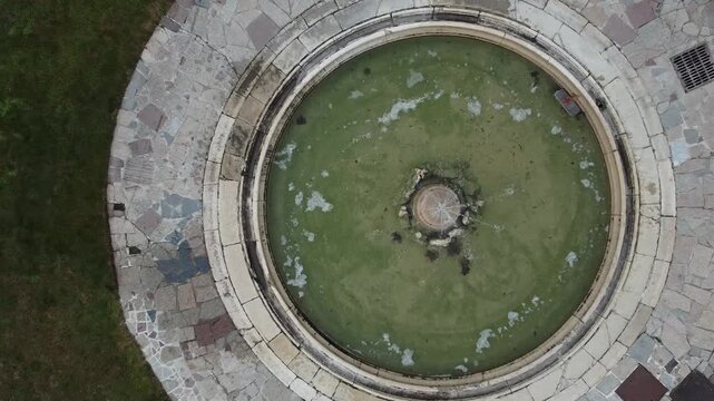 Aerial view of the historic Santa Maria Assunta Church, known as La Rotonda, in Rezzato, Italy. Ancient Romanesque architecture in the Valverde valley, Brescia province.