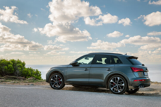 Mallorca - October 18, 2025: Audi Q5 on coastline, car parked on cliff about Mediterranean sea
