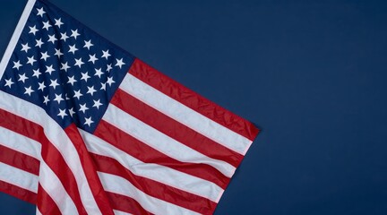 Obraz premium American flag rests on dark blue background with room for text on the right side
