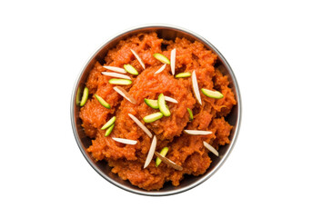 carrot halwa in metal bowl with almond and pistachio garnish