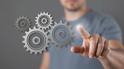 Man presses virtual button next to interlocking gears in a technology concept