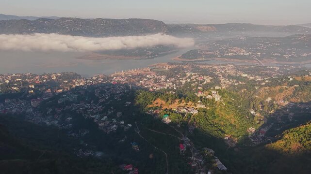 Cinematic morning fog and sunrise over Govind Sagar Lake and Bandla Hills, Himachal