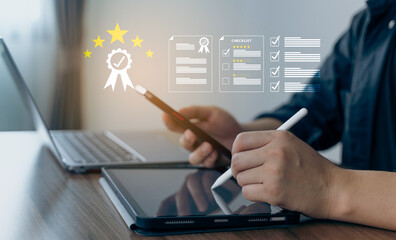 Man working on digital tablet with illustrated icons of checklist, stars, and certification, symbolizing quality control and performance review.