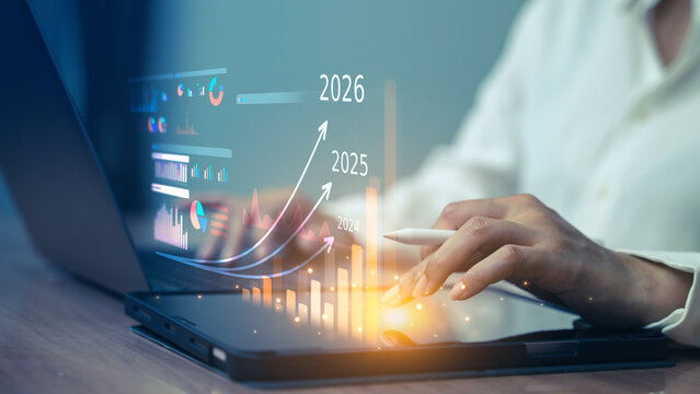 Person using digital tablet with futuristic analytics and growth projections for 2024 to 2026, representing business planning and forecasting. - Powered by Adobe