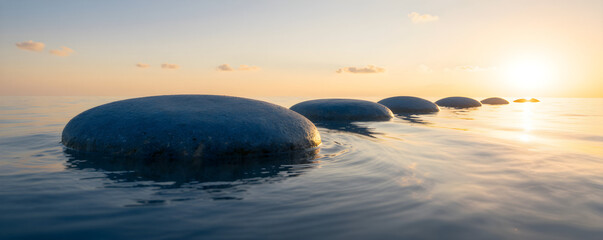 A tranquil landscape photograph featuring a row of smooth pebbles reflecting the warm golden light of the setting sun.