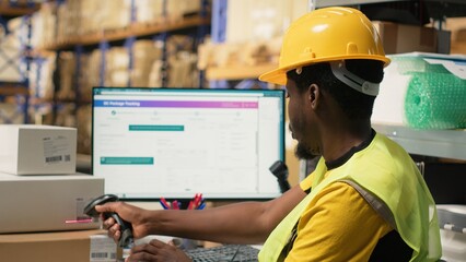 Black staff member using a barcode scanner to process shipping labels on boxes from industrial storage racks. Scanning awb tags for package tracking service and accurate logistics. Camera B.