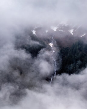 View through a gap in the clouds of the mountainside near Juneau, Alaska.