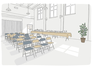 Indoor community hall with folding chairs and tables set up for rummage sale with copy space