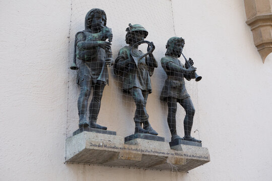 Bronze Musician Statues on Wall of Karlstor Gate Munich Germany