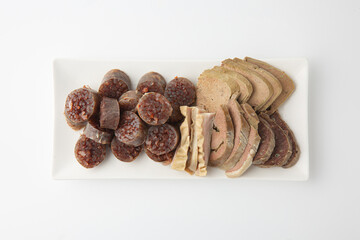 Korean Sundae and Assorted Pork Offal Platter on White Background 순대와 돼지 부산물 모둠 접시