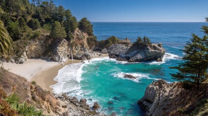 Fototapeta premium Scenic coastal inlet features a secluded beach fed by a small waterfall under a bright blue sky