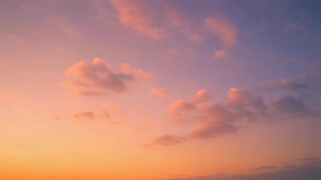 Pastel sunset sky with soft clouds
