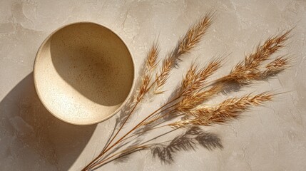 Minimalist Still Life with Textured Bowl and Dried Grasses on Light Beige Background for Modern Home Decor and Natural Aesthetic