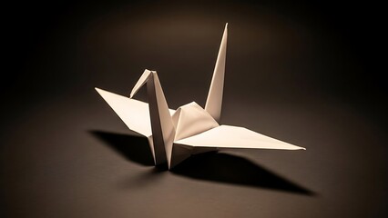 origami bird on black background