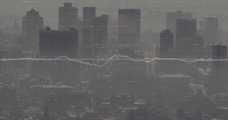 Showing downtown cluster of towers rising through haze above roofs, streets with waveform overlay