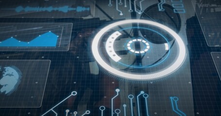 Projecting circular HUD glowing over glass tabletop in control room, suit-jacketed man wearing tie