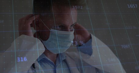 Adjusting medical man in white lab coat pulling surgical mask straps in clinic, with data grid