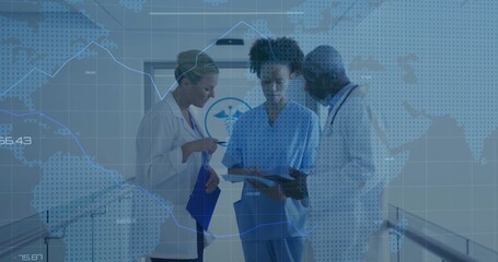 Reviewing three medical team consulting patient chart in hospital corridor, with lab coats, scrubs