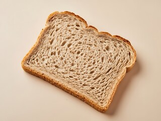 Studio shot of a single slice of whole wheat bread with neutral space
