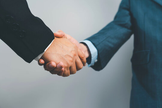 Business people agreement concept. Businessman do handshake with another businessman in the office meeting room. uds