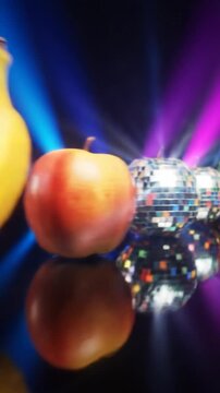 Disco Ball Fruits Panning Past Mirrored Apple Pear and Banana with Motion Blur