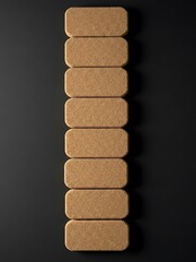 Vertical Arrangement of Rectangular Cork Tiles on Minimalist Black Backdrop