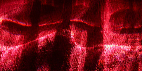 Dark red silk or satin fabric texture with dramatic lighting and shadow effects