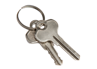 Two metal keys attached to a ring, isolated on a dark background