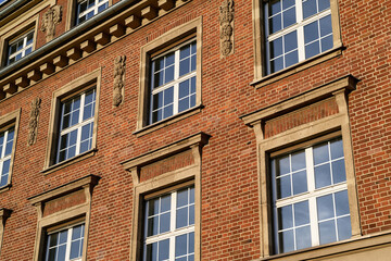 Fototapeta premium Detail of the red brick architecture of the former ThyssenKrupp administrative building in Ehrenfeld, Cologne, featuring neoclassical ornaments