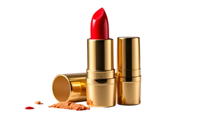 A vibrant red lipstick stands tall, flanked by its golden casing. A small amount of powder lays near. The background is black