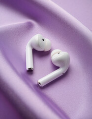White Wireless Earbuds on Soft Purple Silk Background, Minimalist Audio Tech Product Photography, Top View