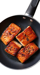 Glazed salmon fillets sizzling in a black frying pan, close-up food shot