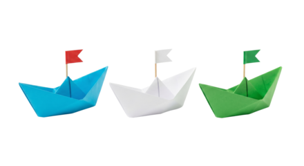 Three colorful origami paper boats with flags on white background
