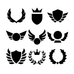 Fototapeta premium Collection of vector heraldic elements including laurel wreaths shields wings and ribbons perfect for creating logos or designs. black-and-white vector pack of wreaths, shields, banners, and wings.