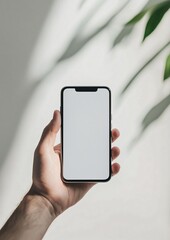 Hand Holding Smartphone with Blank Screen and Natural Light Background