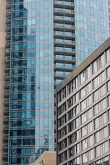 Fototapeta premium Canada, Montreal, 23 December 2025 : Modern glass skyscrapers towering above cityscape in urban environment