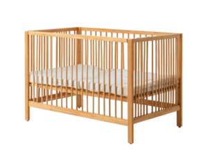 Simple light-wood crib with a white mattress, standing alone on black background