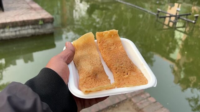 Patishapta is a traditional Bengali sweet crepe or pancake