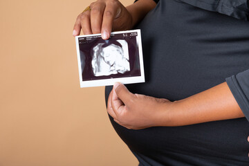 Pregnant woman big belly final weeks of pregnancy gender reveal