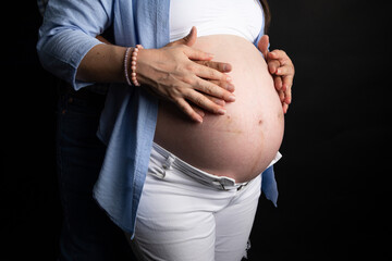 Pregnant woman big belly final weeks of pregnancy gender reveal