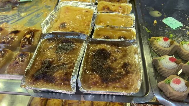 Freshly prepared Bengali child baked Sandesh with gur available in a store in Kolkata