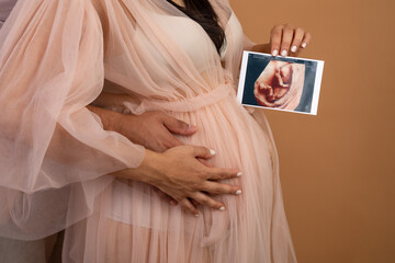 Pregnant woman big belly final weeks of pregnancy gender reveal