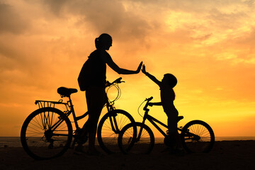 Mother giving daughter high five. Parent child relationship concept. Family support, childhood, trust togetherness, bonding, Love, motherhood concept	