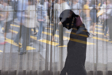 Lonely woman in a crowded busy city suffering with social anxiety depression 